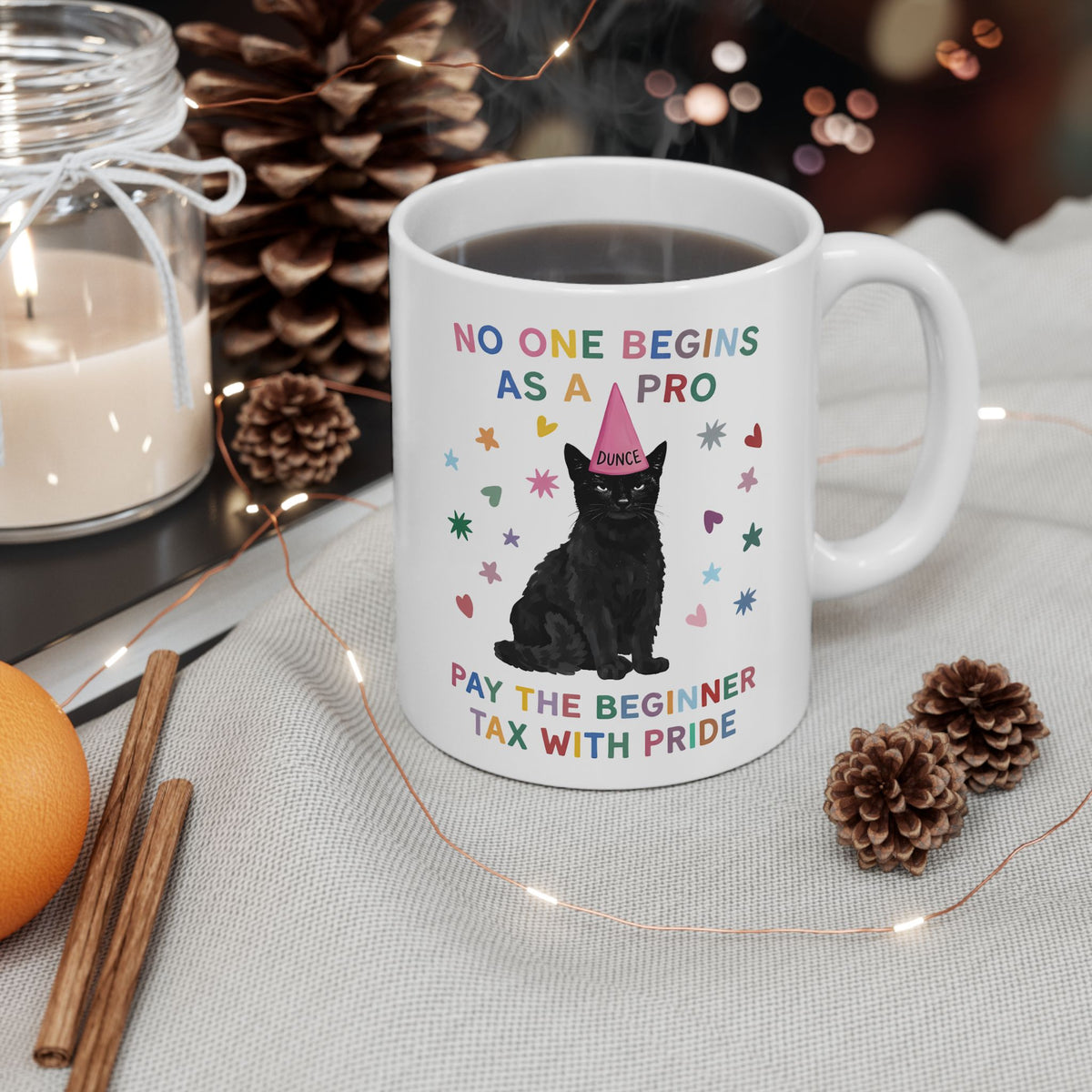 No One Begins As A Pro Ceramic Mug — Funny Black Cat Dunce Hat Beginner Tax Mug