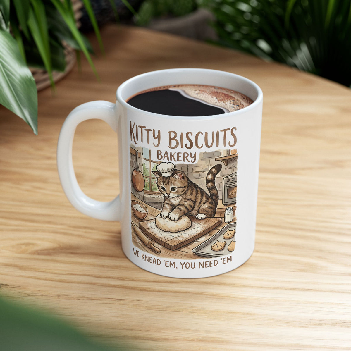 Kitty Biscuits Bakery Ceramic Mug — "We Knead 'Em We Need 'Em" Cat Bakery Mug